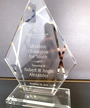 An award for 'The Boys and Girls Club Lifetime Champion for Youth' Presented to Robert and Angie Alexander in 2019
